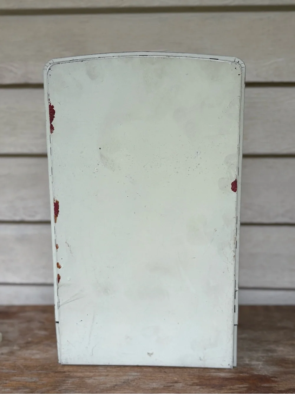 VTG 1950s Wolverine Supply metal toy refrigerator, featuring a white finish